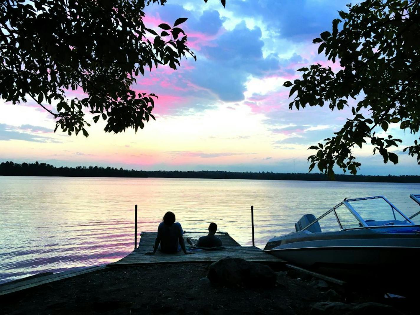 Brothers Nathan and Gabe Usem watched the sunset from the dock on White Iron Lake. Photo by Jenna Ross * jenna.ross@startribune.com