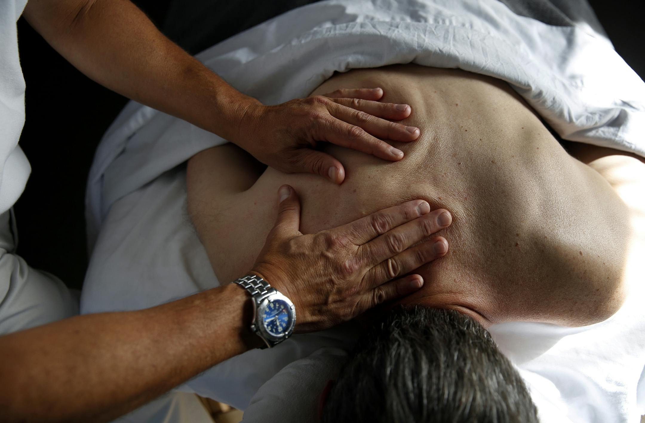 Jeff Goldstein works on a client inside his studio Uptown Massage in Minneapolis. ] LEILA NAVIDI leila.navidi@startribune.com / BACKGROUND INFORMATION: Thursday, October 9, 2014. After 32 years as a futures trader, Jeff Goldstein decided to try something different. He became a massage therapist who specializes in helping people with special needs, including drug addicts and clients with life-threatening illnesses.