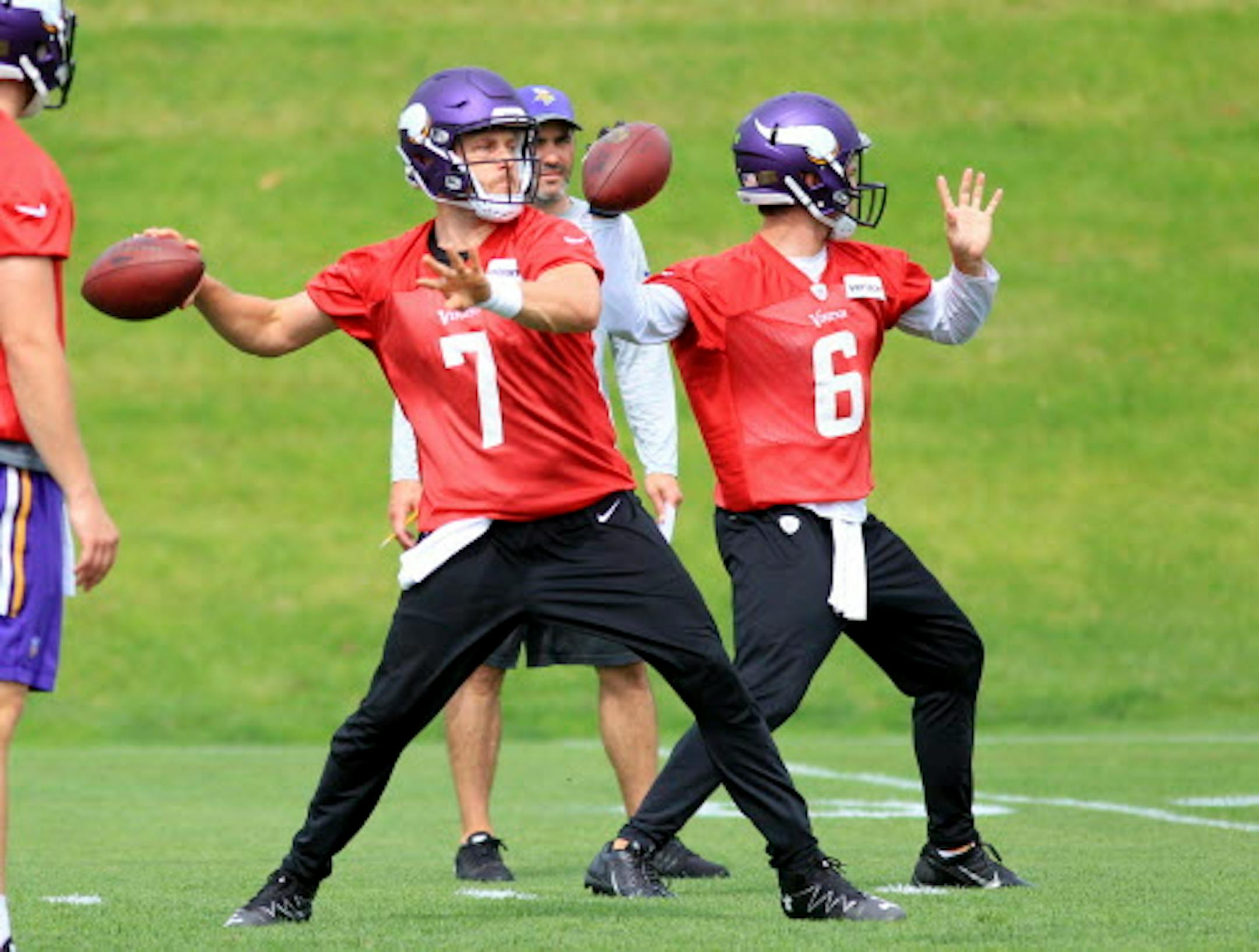Minnesota Vikings quarterbacks Case Keenum (7) and Taylor Heinicke (6) throw passes during NFL football practice, Tuesday, June 13, 2017, in Eden Prairie, Minn. (AP Photo/Andy Clayton-King)