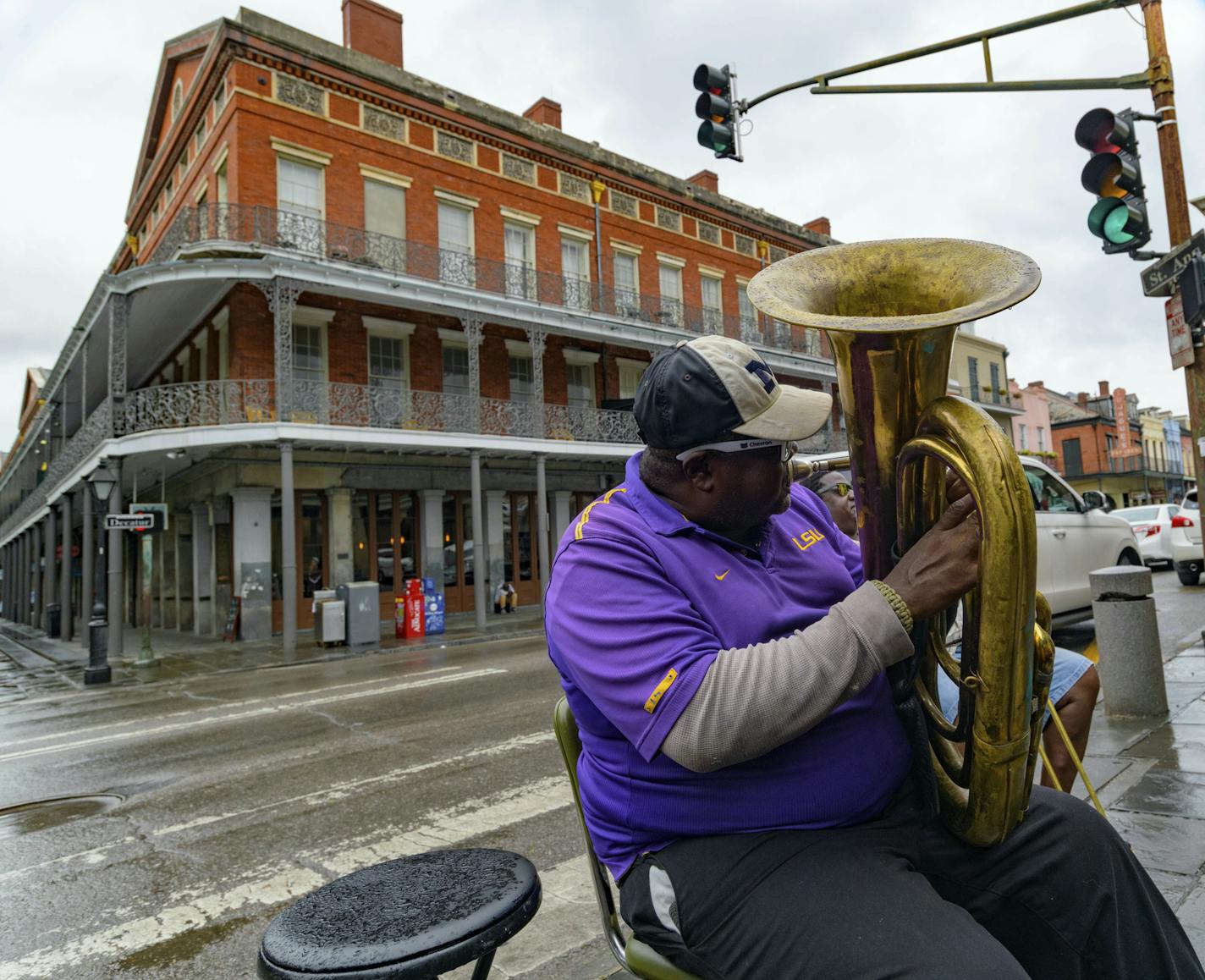 A musician plays in the French Quarter before landfall of Tropical Storm Barry from the Gulf of Mexico in New Orleans, La., Friday, July 12, 2019. (AP Photo/Matthew Hinton) ORG XMIT: LAMH109