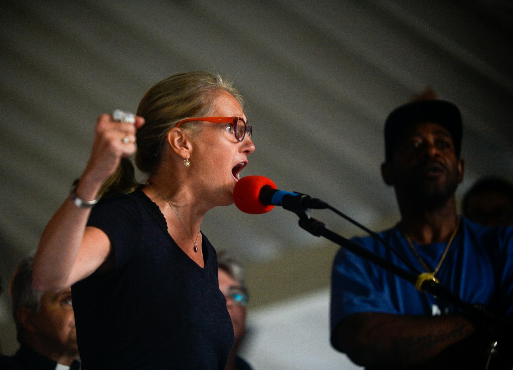 Sarah Kuhnen, a neighbor of Justine Damond, energized protesters as she spoke out against police shootings at Beard's Plaissance Park during the Peace and Justice March for Justine Thursday night.