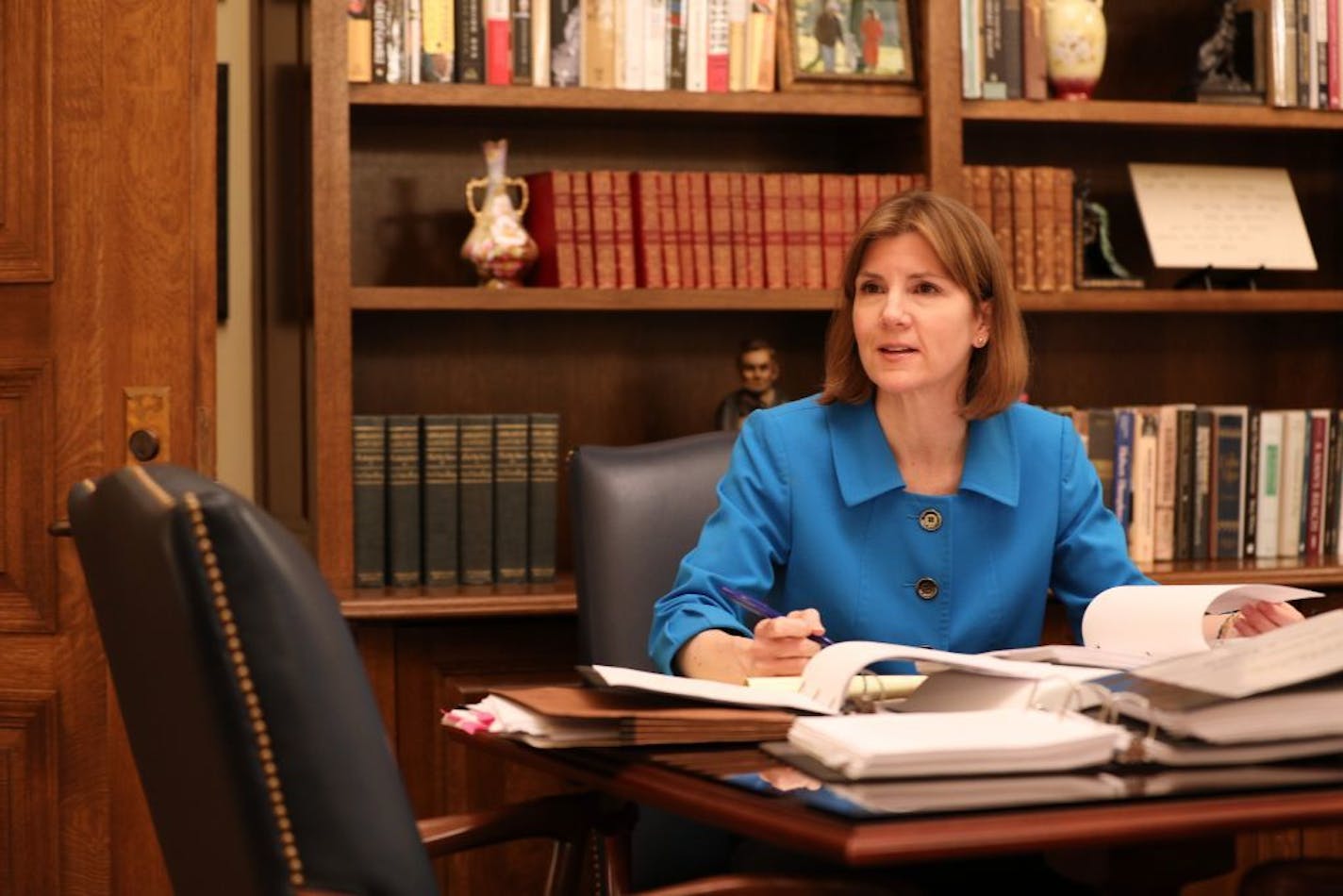 Minnesota Attorney General Lori Swanson talked with her spokesperson Ben Wogsland as she reviewed evidence in the case of President Donald Trump's immigration ban targeting seven predominantly Muslim countries Friday in her office.