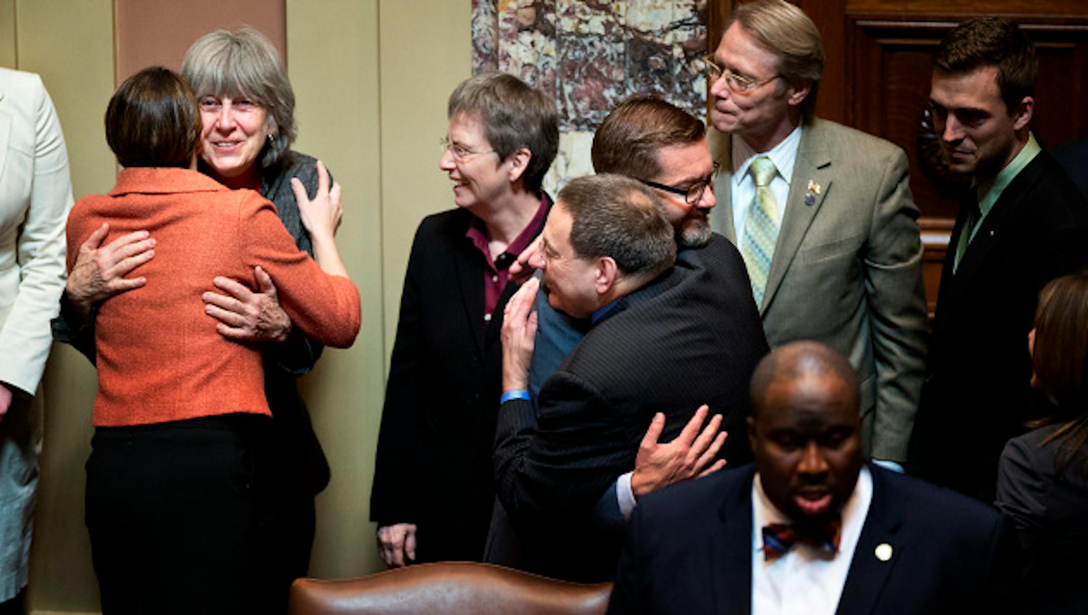 Senator Scott Dibble and Rep. Karen Clark received congratulatory hugs after passage of the bill  37-30.    Monday, May 13, 2013    ]   GLEN STUBBE * gstubbe@startribune.com