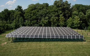This July 2013 photo provided by the Wright Hennepin Cooperative Electric Association shows the first community solar array in Minnesota, in Rockford,