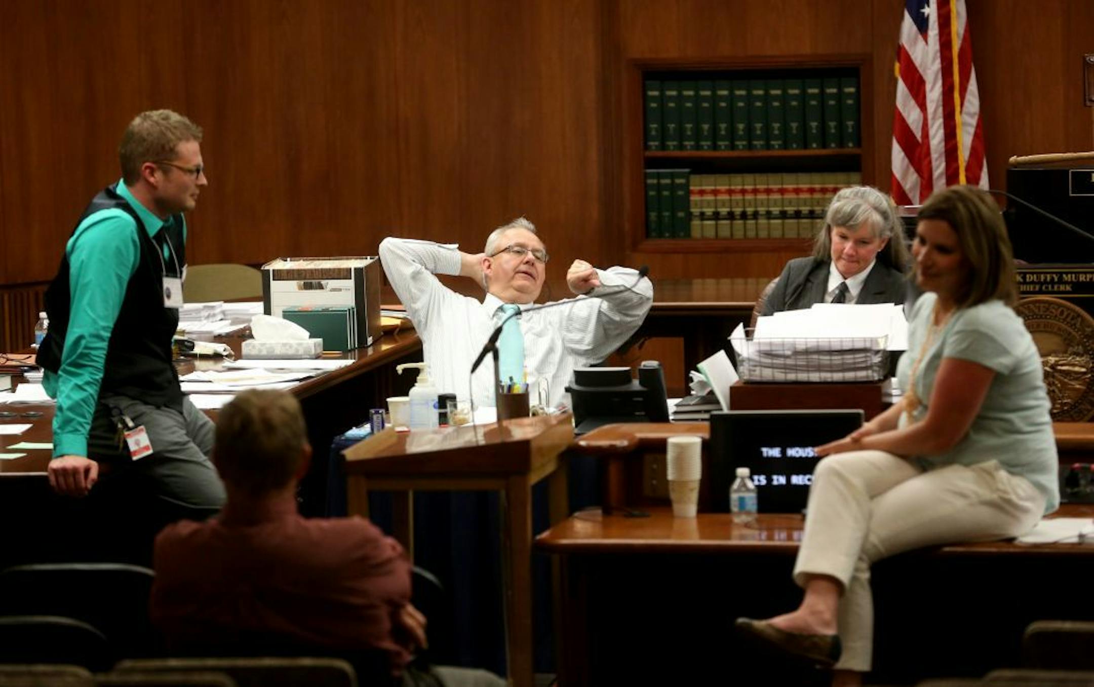 Minnesota House members and aides chatted with one another during a recess late in the special session.