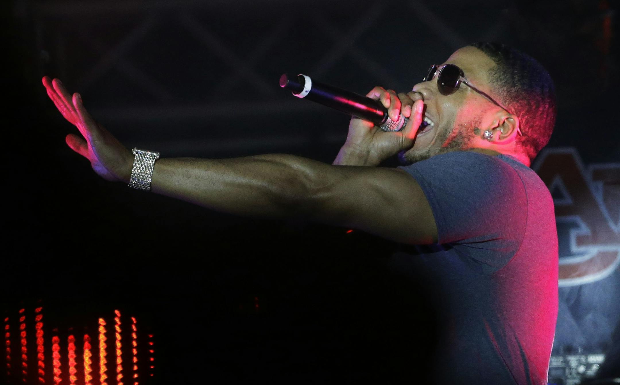 Rapper Nelly preforms on stage during a Corner Block Party concert at Auburn University, Saturday, April 18, 2015, in Auburn, Ala. Nelly was arrested on drug charges last Saturday, April 11, 2015. (AP Photo/Brynn Anderson)