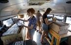(From left) Alison Caldwell, Chris Lankford and Brita Mackey look at records in the Rockin' Roller. ] ALEX KORMANN &#x2022; alex.kormann@startribune.c
