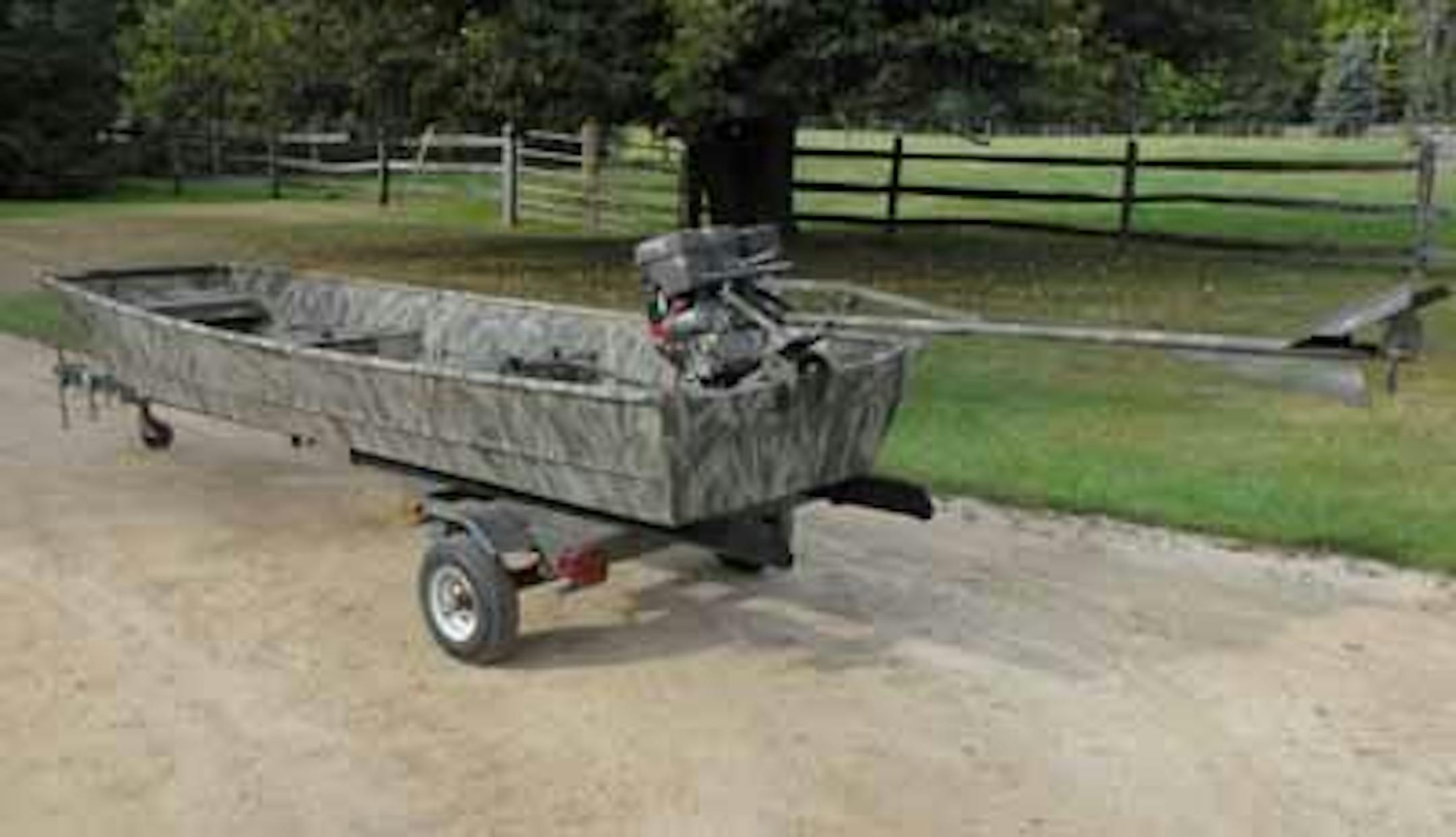 An old jon boat with a new camouflage paint job.