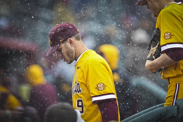 Gopher&#x2019;s Michael Handel walked off the field during a snow delay (officials eventually called the game) on opening day at the new Siebert Field
