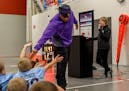 Former Minnesota Vikings linebacker E.J. Henderson visited schoolchildren in Worthington, where $60,000 in Super Bowl legacy grants were awarded.