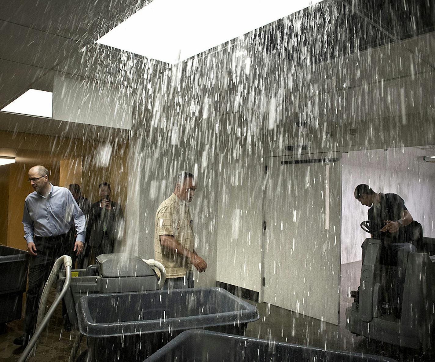 Rainwater poured from a blown vent in a pipe in a newly constructed tunnel area under the State Capitol on Sunday.