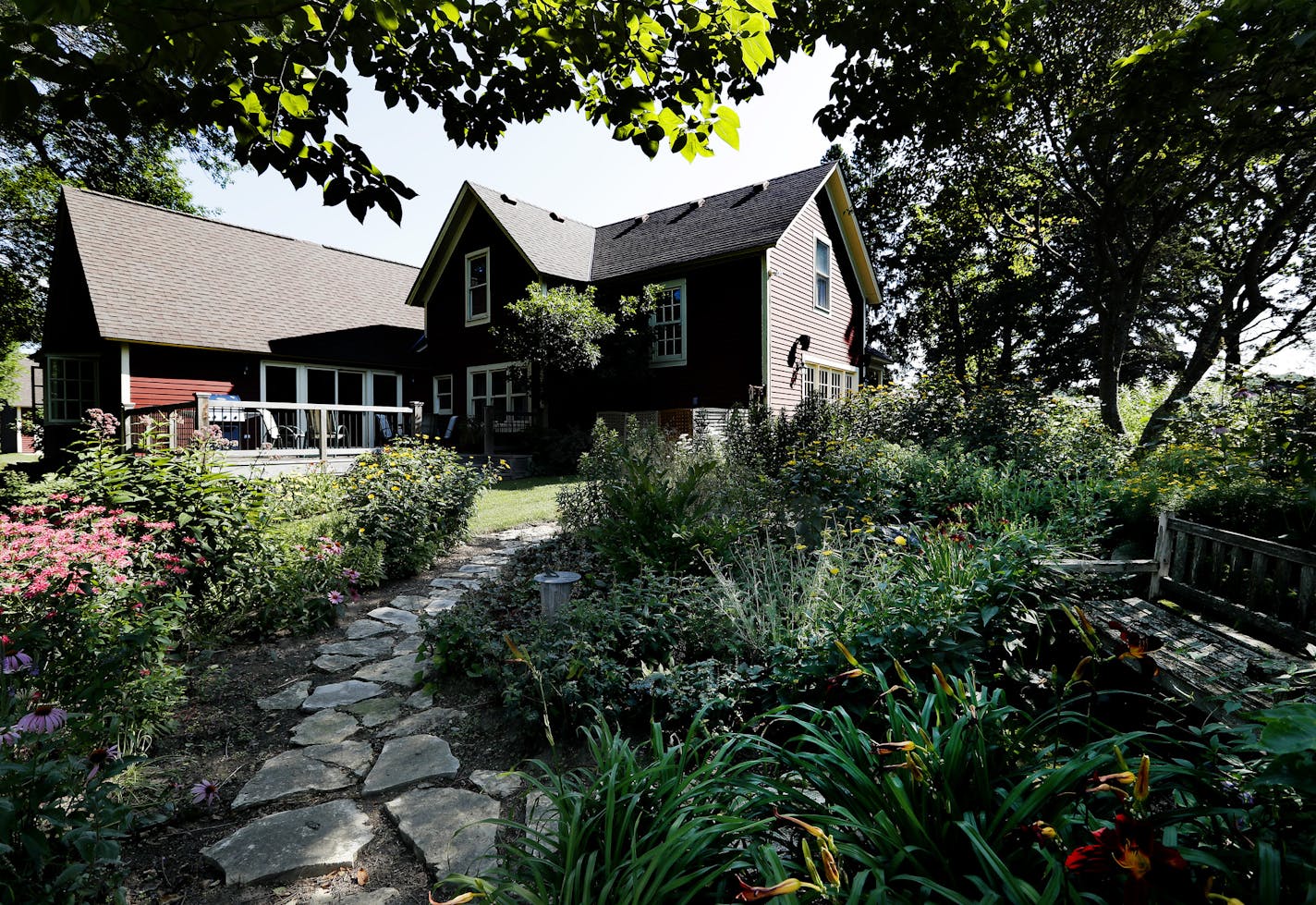 A stone path meanders past native plants in Lynn Steiners garden.