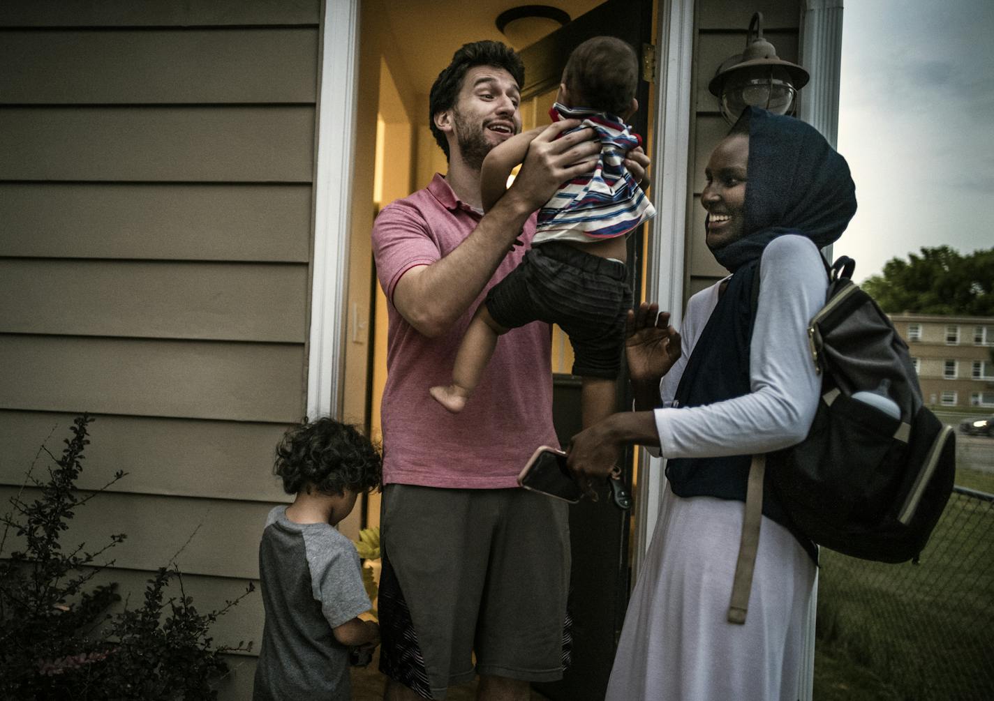 The nonprofit NeighborWorks Home Partners helped Naima Mohamed, right, and Jacob Croonenberghs buy a house in St. Paul for their growing family.