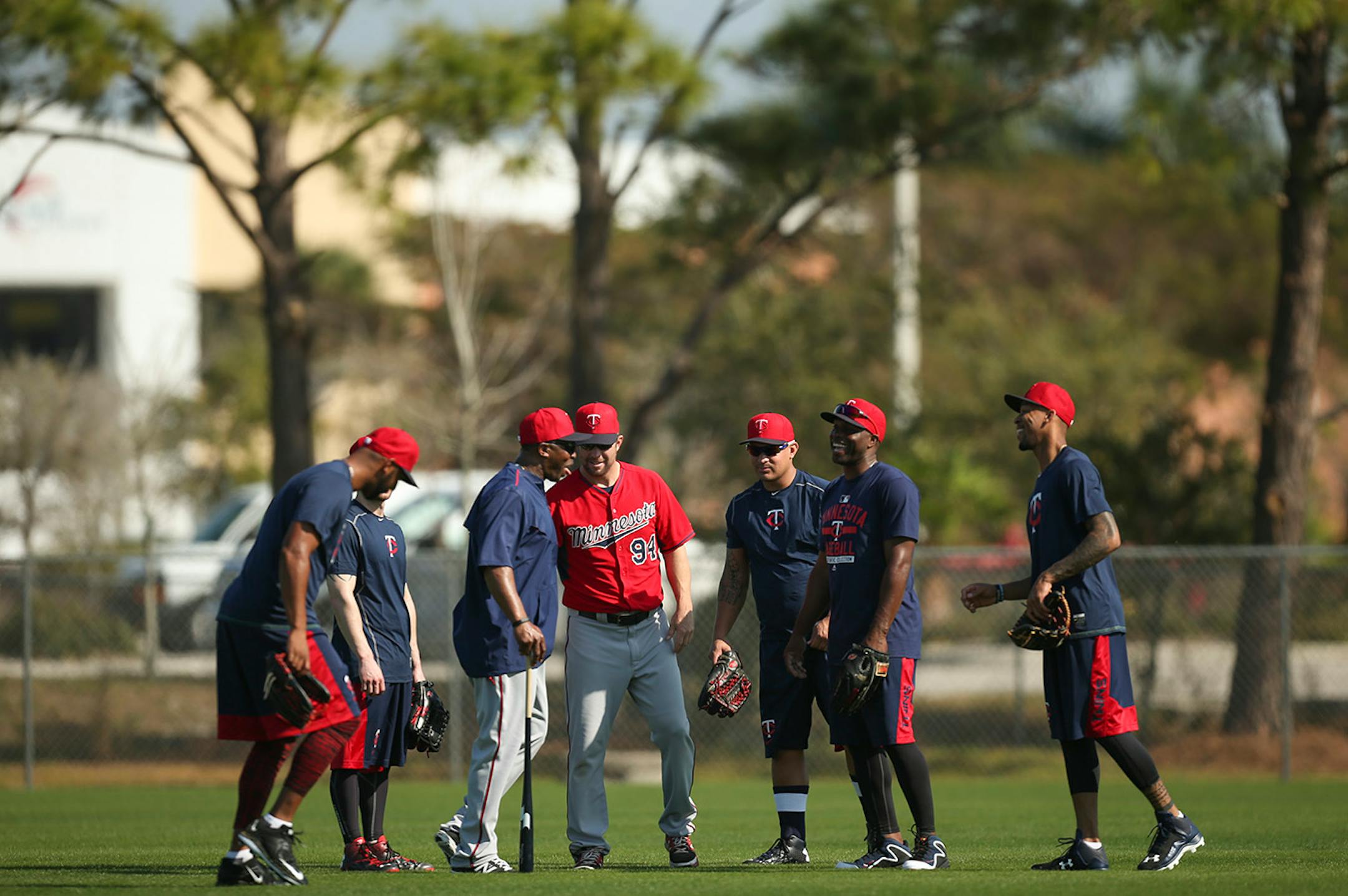 Outfielders, including Torii Hunter, second from right, and their coaches joke around during a workout Tuesday morning at Hammond Stadium. ] JEFF WHEELER ï jeff.wheeler@startribune.com Twins pitchers and catchers continued their workouts Tuesday morning, February 24, 2015 at Hammond Stadium in Fort Myers, FL.