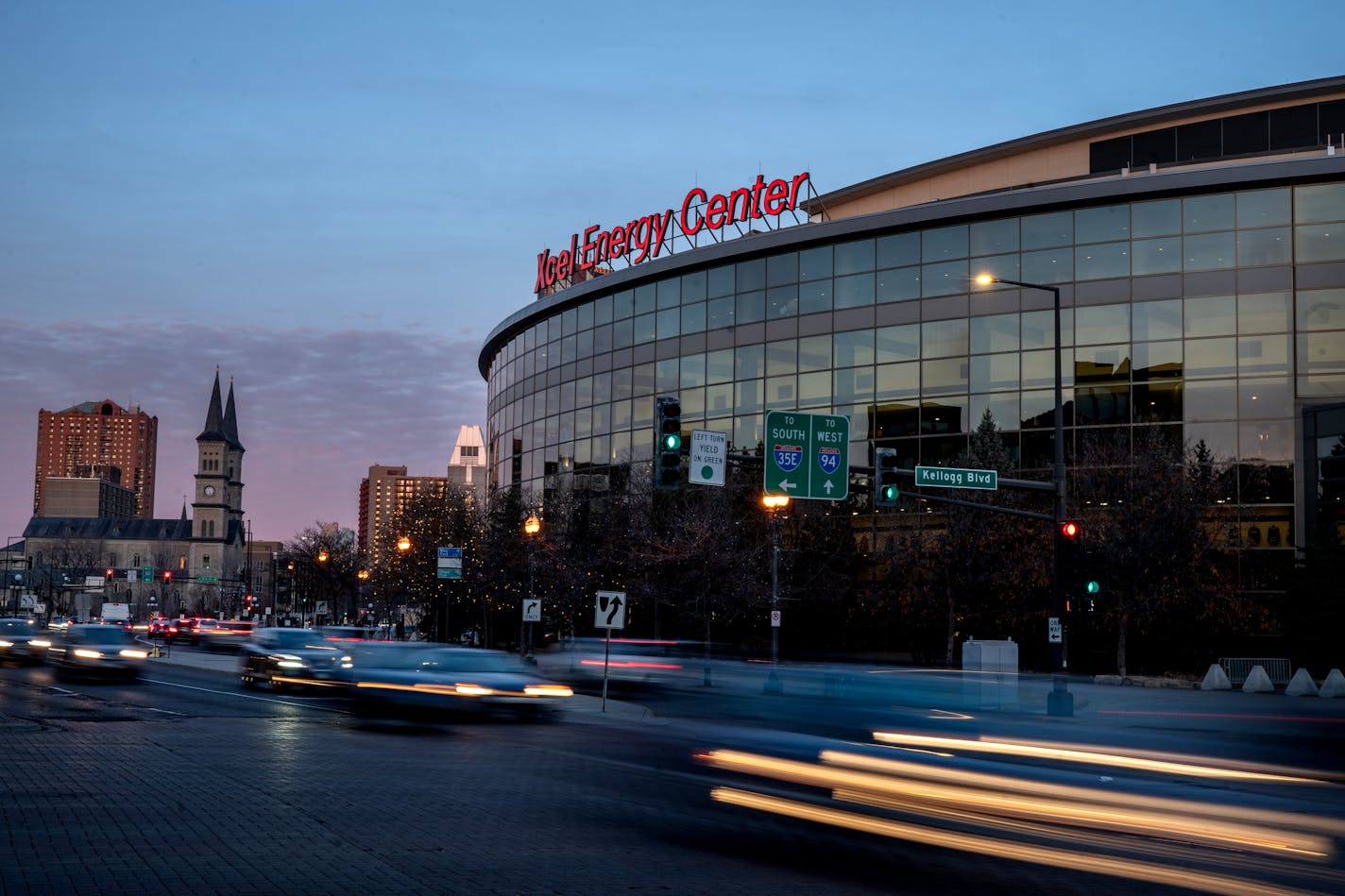 An exterior view at night of Xcel Energy Center in downtown St. Paul.