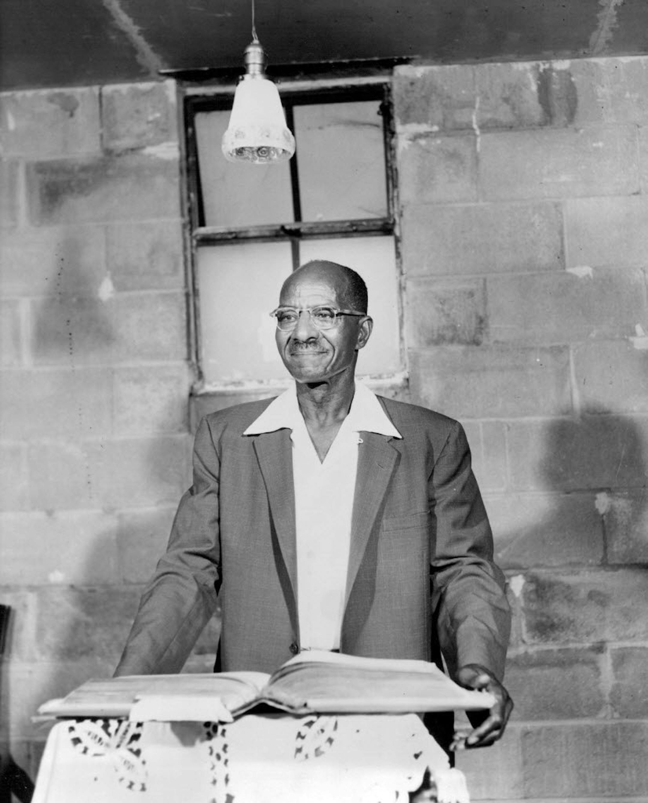 In 1957, the Rev. J. J. Jackson at a gray cinderblock basement building at 51st and James avenues N. On one corner of the unpainted basement is tacked a crudely lettered sign: "Pilgrim Rest Baptist church."