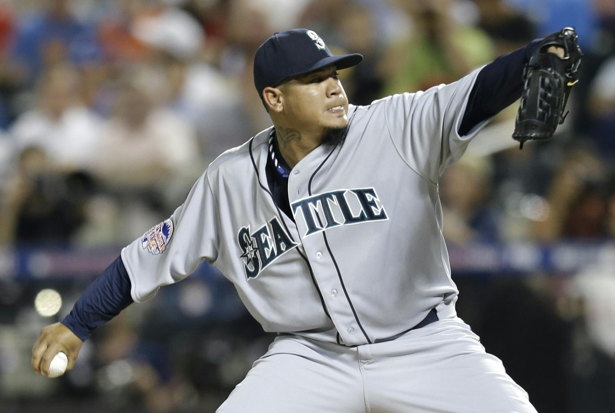Felix Hernandez, of the Seattle Mariners, pitches during the fourth inning of the MLB All-Star baseball game, on Tuesday, July 16, 2013, in New York.
