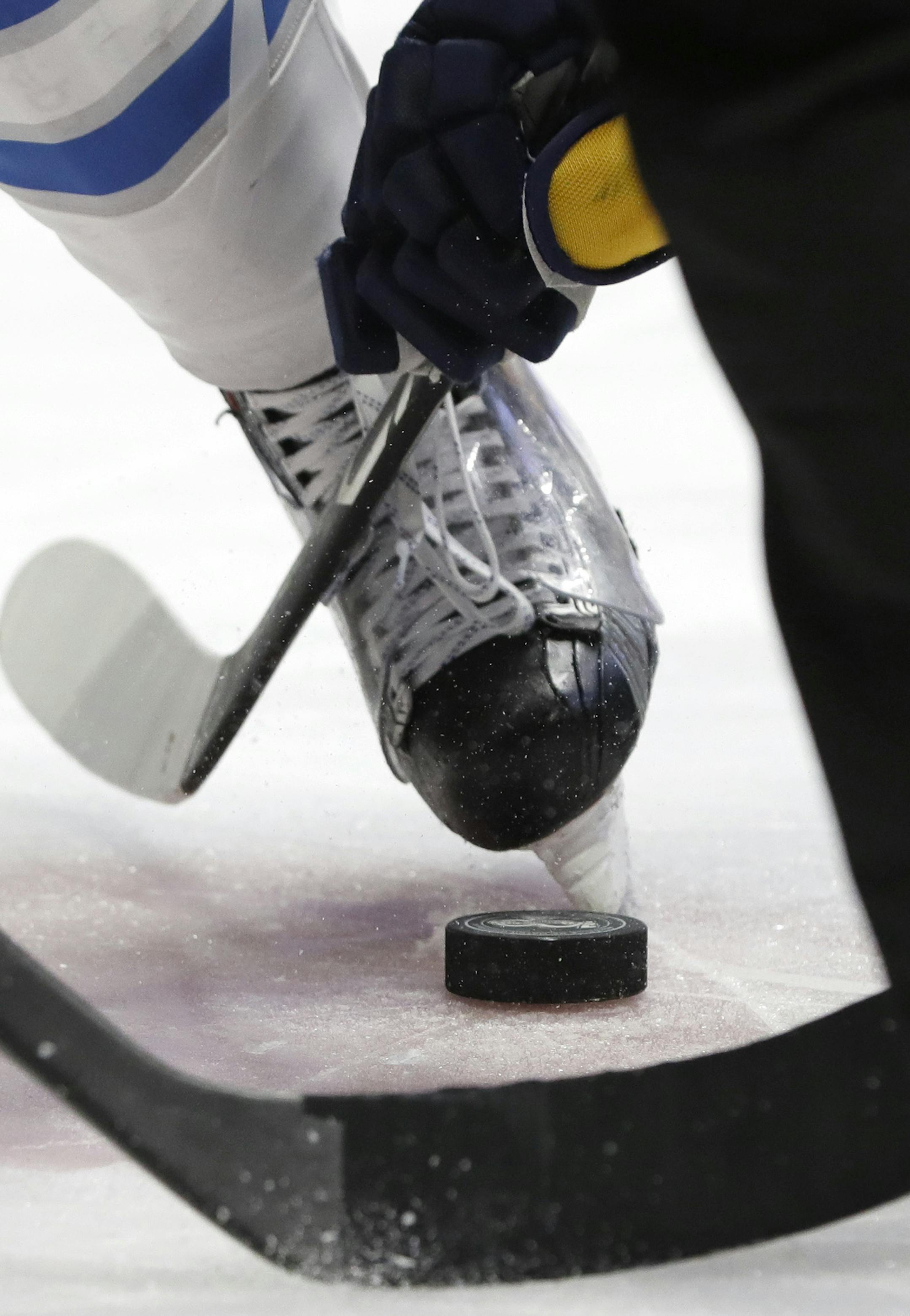 A puck is dropped during a face-off in the second period of an NHL hockey game between the Nashville Predators and the Winnipeg Jets Monday, March 13, 2017, in Nashville, Tenn. (AP Photo/Mark Humphrey)