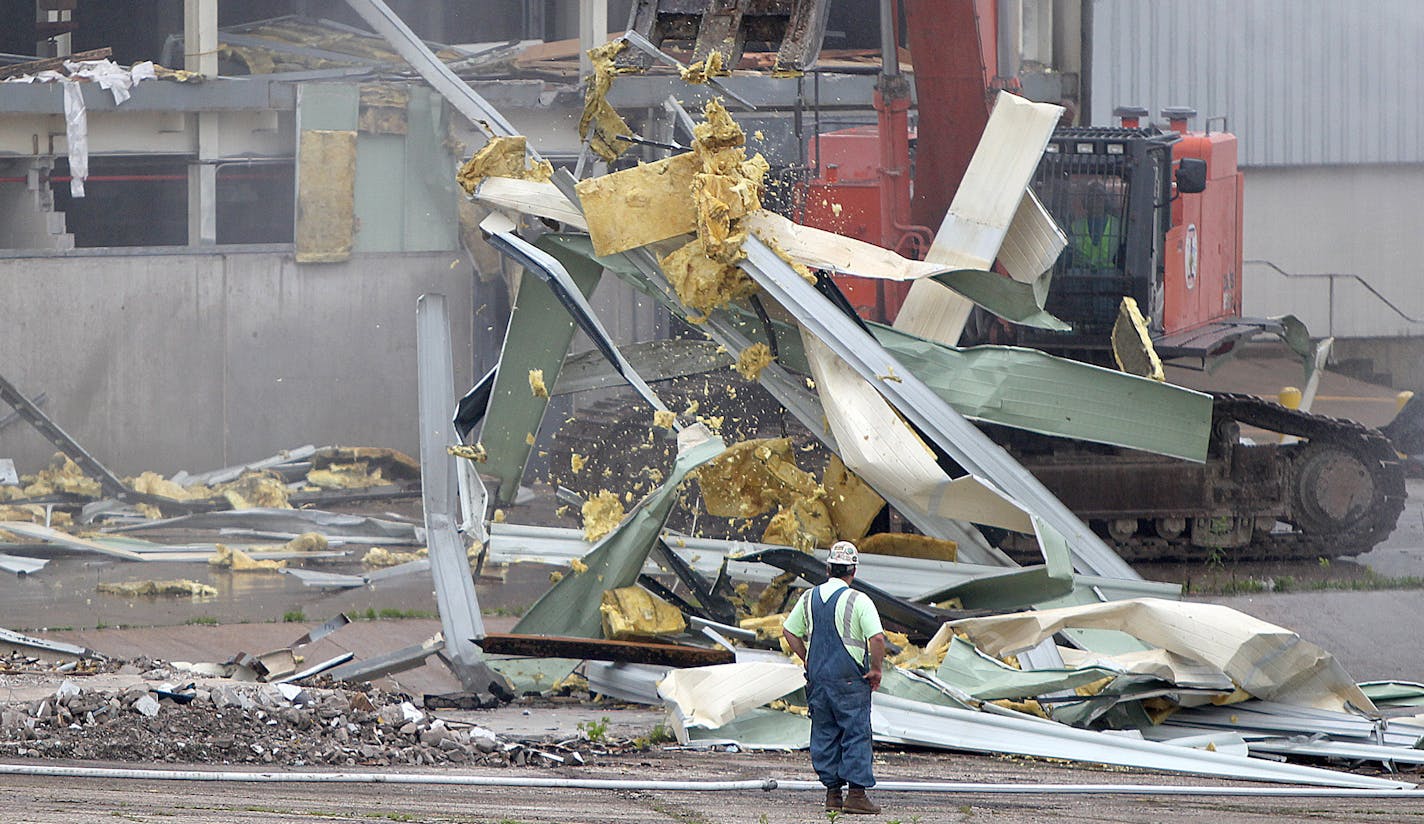 Demolition crew took down the paint building of the 150-acre former Twin Cities Ford Assembly Plant, Monday, June 10, 2013 in St. Paul, MN. The Ford company has played an important role in St. Paul for nearly 90 years. (ELIZABETH FLORES/STAR TRIBUNE) ELIZABETH FLORES &#x2022; eflores@startribune.com