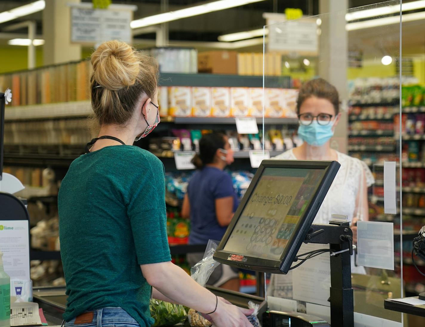 Mississippi Market in St. Paul has made changes since the pandemic began, including installing plexiglass at checkouts.