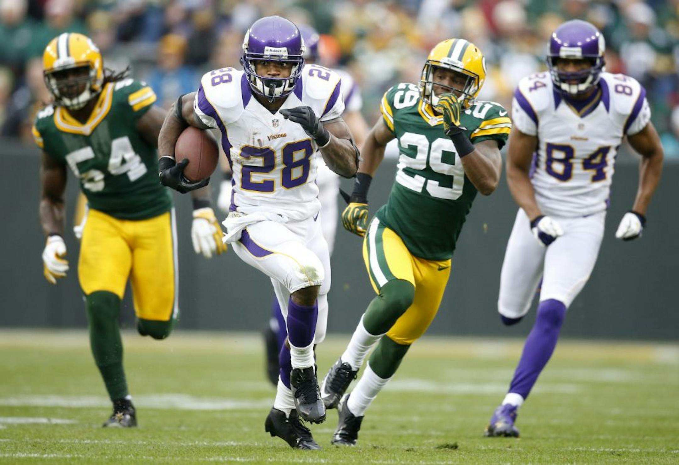 Minnesota Vikings running back Adrian Peterson (28) broke away from the Green Bay defense for a 48-yard run in the third quarter. Peterson has 210 yard rushing in the loss. Green Bay beat Minnesota by a final score of 23-14.