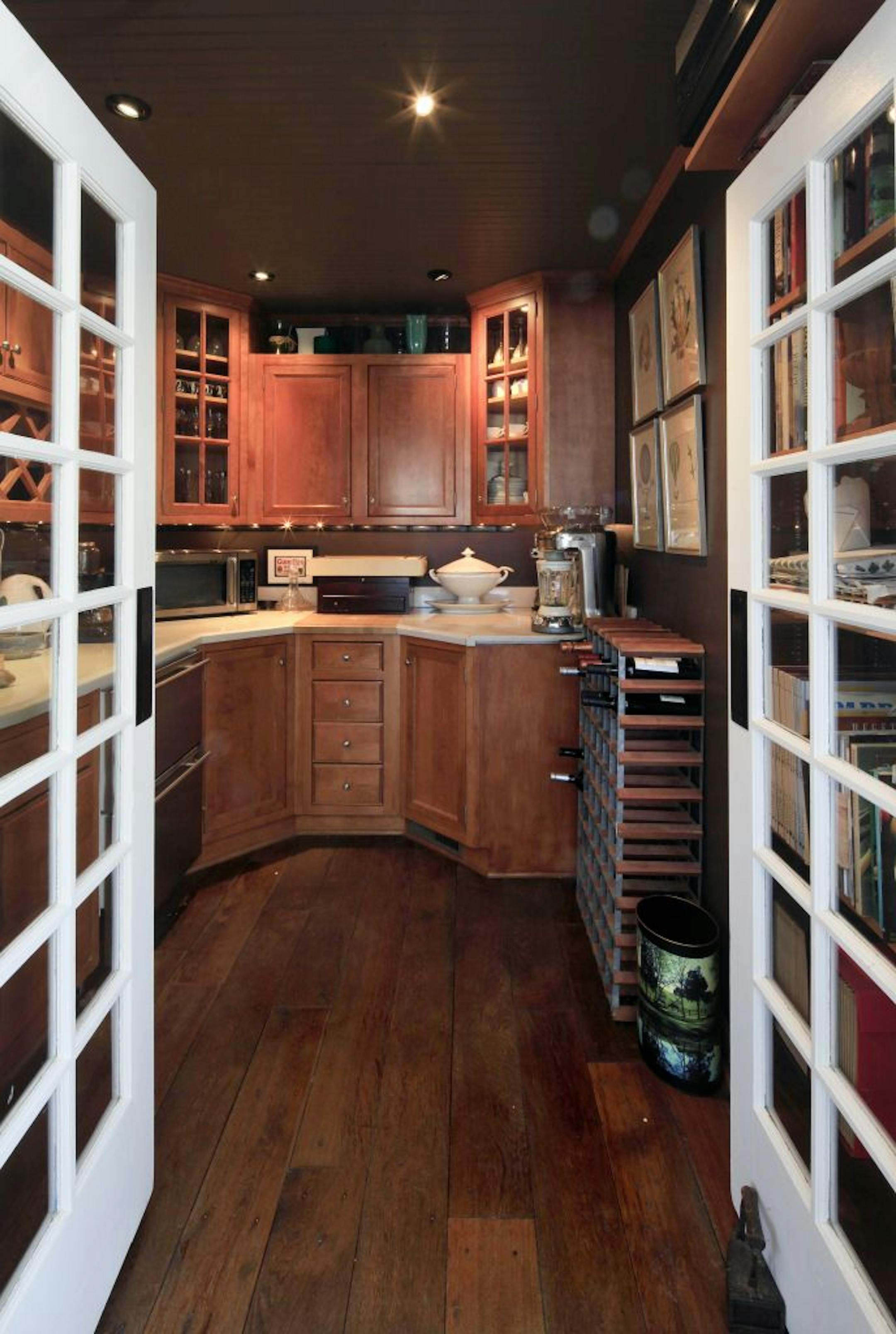 Musician Chan Poling's pantry/wine room next to the kitchen in his home in Prior Lake, MN on February 11, 2013.