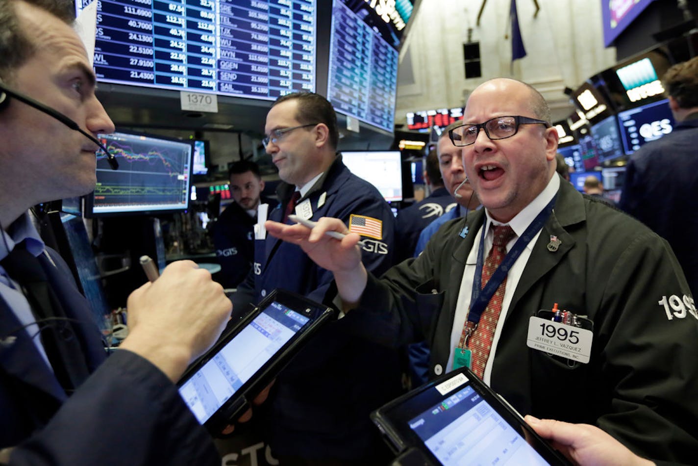 The Dow Jones industrial average closed up Friday by more than 300 points after a week of volatile moves that saw two days suffer 1,000-point losses.