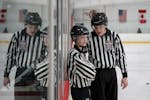 Sibling referees Sedona Stumpf and DJ Stumpf work together reffing a couple youth hockey games on Friday, Jan. 20, 2023 in Stillwater, Minn. ] RENEE J