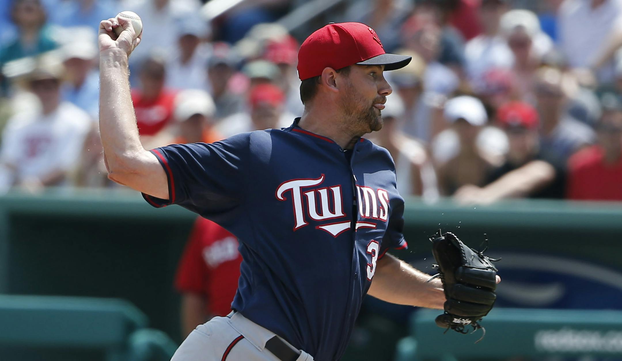 Minnesota Twins' starting pitcher Mike Pelfrey (37) delivers against the Boston Red Sox in the first inning during an exhibition spring training baseball game, Wednesday, March 18, 2015, in Fort Myers, Fla. (AP Photo/Brynn Anderson)