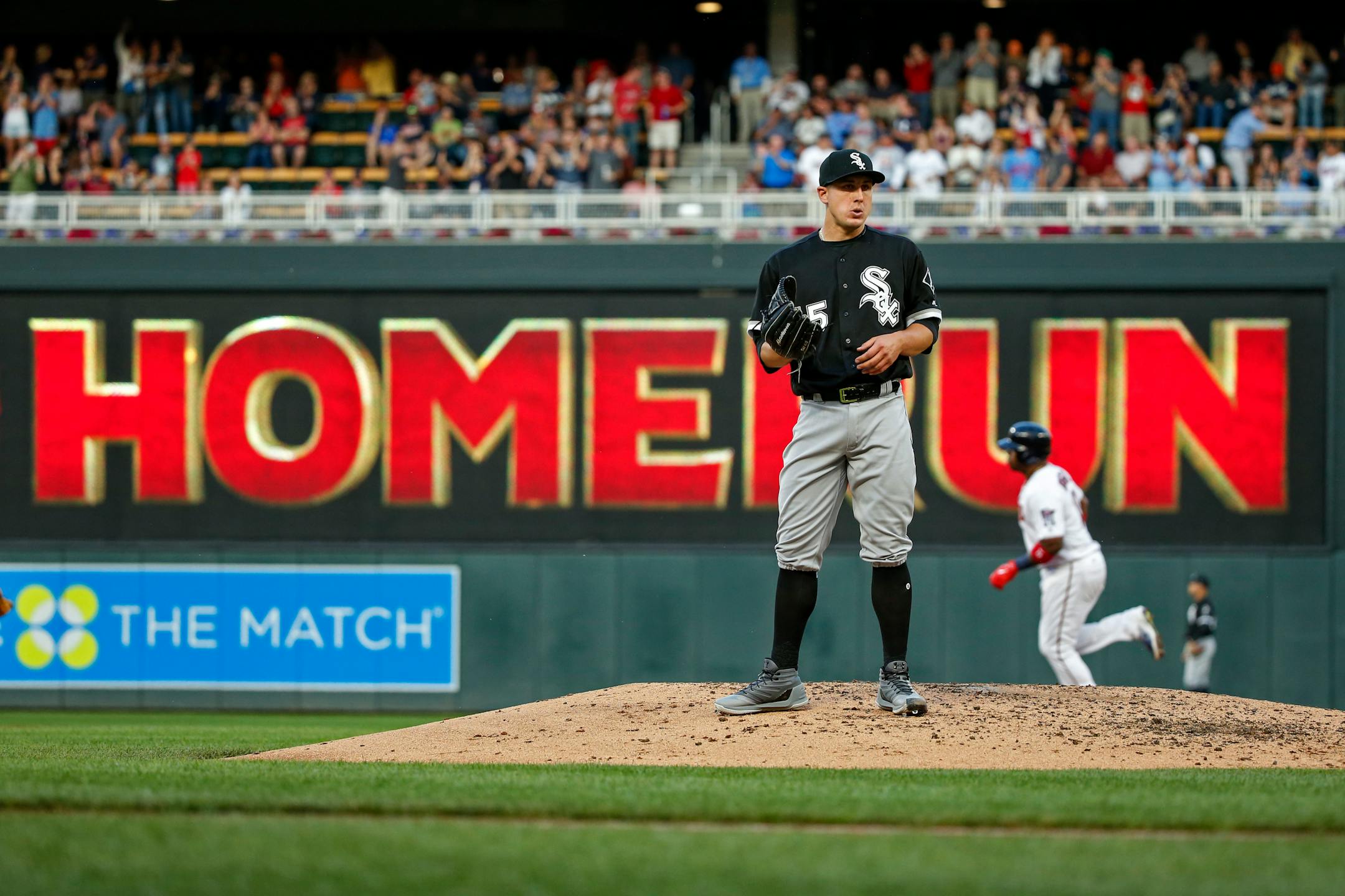 Chicago White Sox starting pitcher Derek Holland stands on the mound as Minnesota Twins' Kennys Vargas runs the bases on a three-run home run durimg the third inning of a baseball game Tuesday, June 20, 2017, in Minneapolis. (AP Photo/Bruce Kluckhohn)