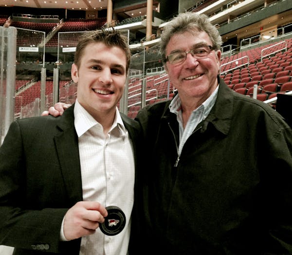 Zach Parise (left) and his father, J.P. Parise, in a photo taken last year in Phoenix when Zach passed his father on the NHL's all-time goal scoring l