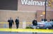 Investigators from the Anoka County Sheriff's Office and the Blaine Police Department investigated the scene of an early morning shooting at a Walmart