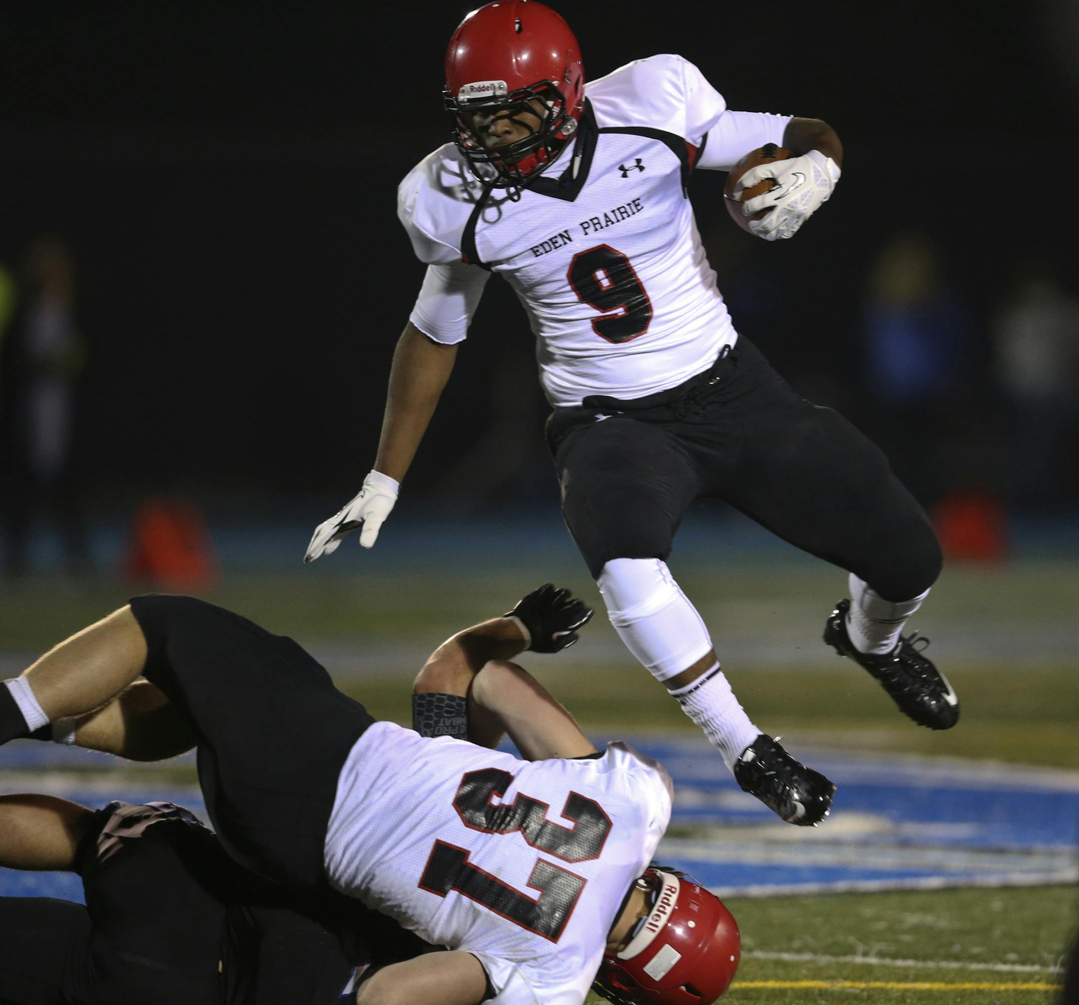 Eden Prairie runningback Anthony Anderson (9) hurdles teammate Dan Fisher (37) during a first quarter run against Minnetonka High Friday, Oct. 4, 2013, at Minnetonka High, in Minnetonka, MN.](DAVID JOLES/STARTRIBUNE) djoles@startribune.com Eden Prairie at Minnetonka High in prep football action Friday, Oct. 4, 2013.**Anthony Anderson, Dan Fisher,cq