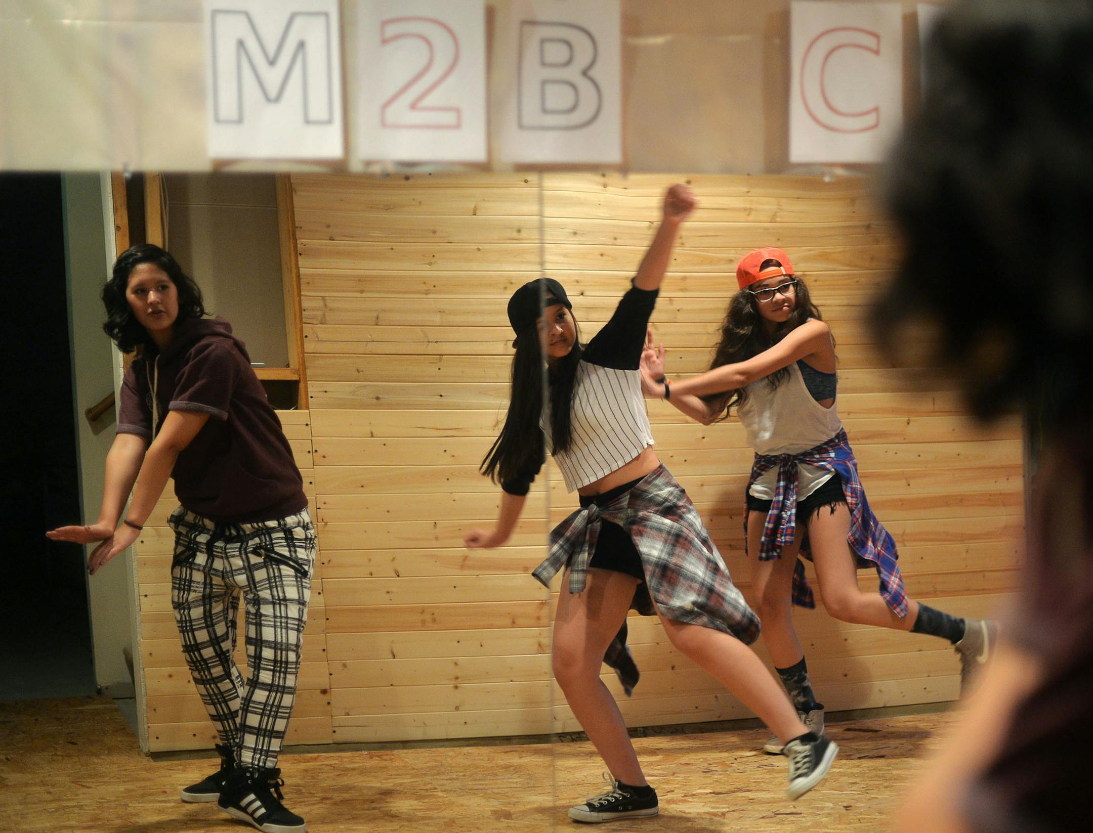 From left, Skylar Wolfe, 16, Addison Wolfe, 14, and Allison Quintana, 14, all of the hip hop dance group M2B Crew, practiced their routine in Woodbury, Minn., on Monday July 20, 2015. ] RACHEL WOOLF &#xb7; rachel.woolf@startribune.com