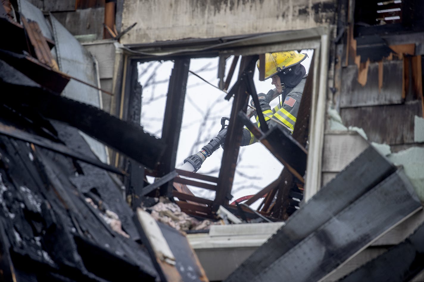 Minneapolis firefighters returned to the scene to continue to battle a destructive fire that destroyed several businesses on the 2400 block of Central Avenue, Monday, March 23, 2020 in Minneapolis, MN. ] ELIZABETH FLORES &#x2022; liz.flores@startribune.com