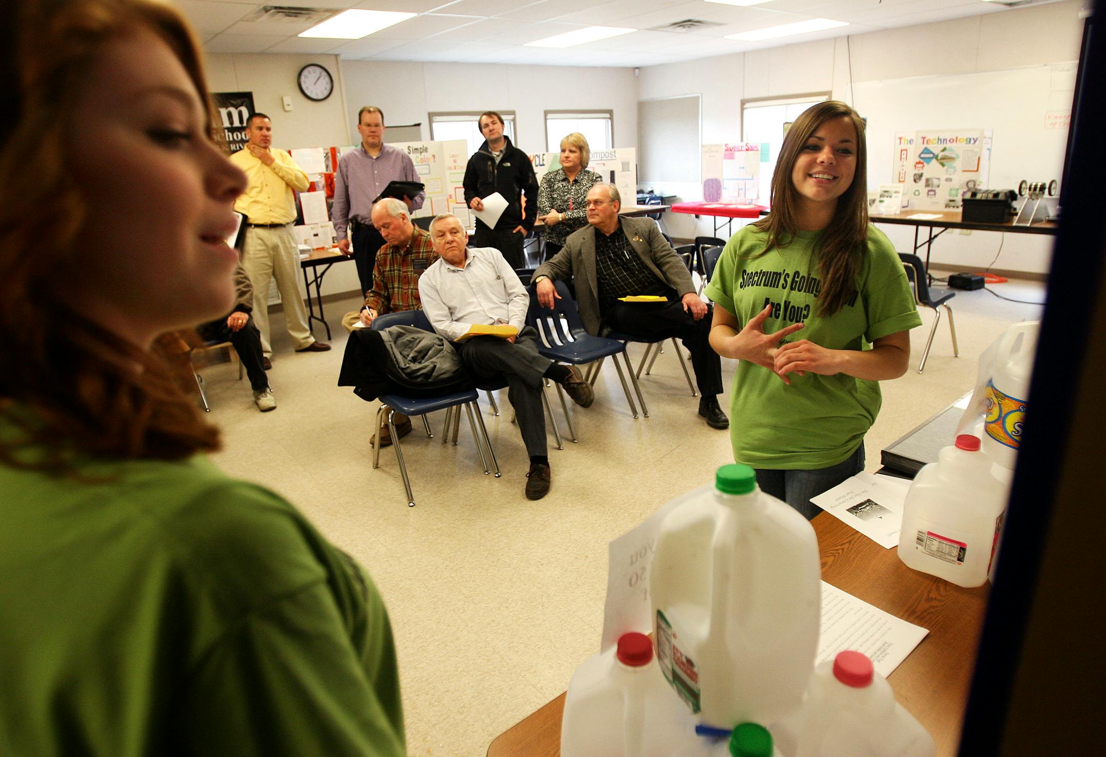Spectrum High School students Sarah Gnitka, right, and Sami Johnson talked about their water-conservation senior project during Energy Expo contest judging at the school. Teams of two to three students got 10 minutes to talk about their energy-saving projects, which were judged by members of Elk River's Energy City Commission. Winning projects will be displayed at the expo.