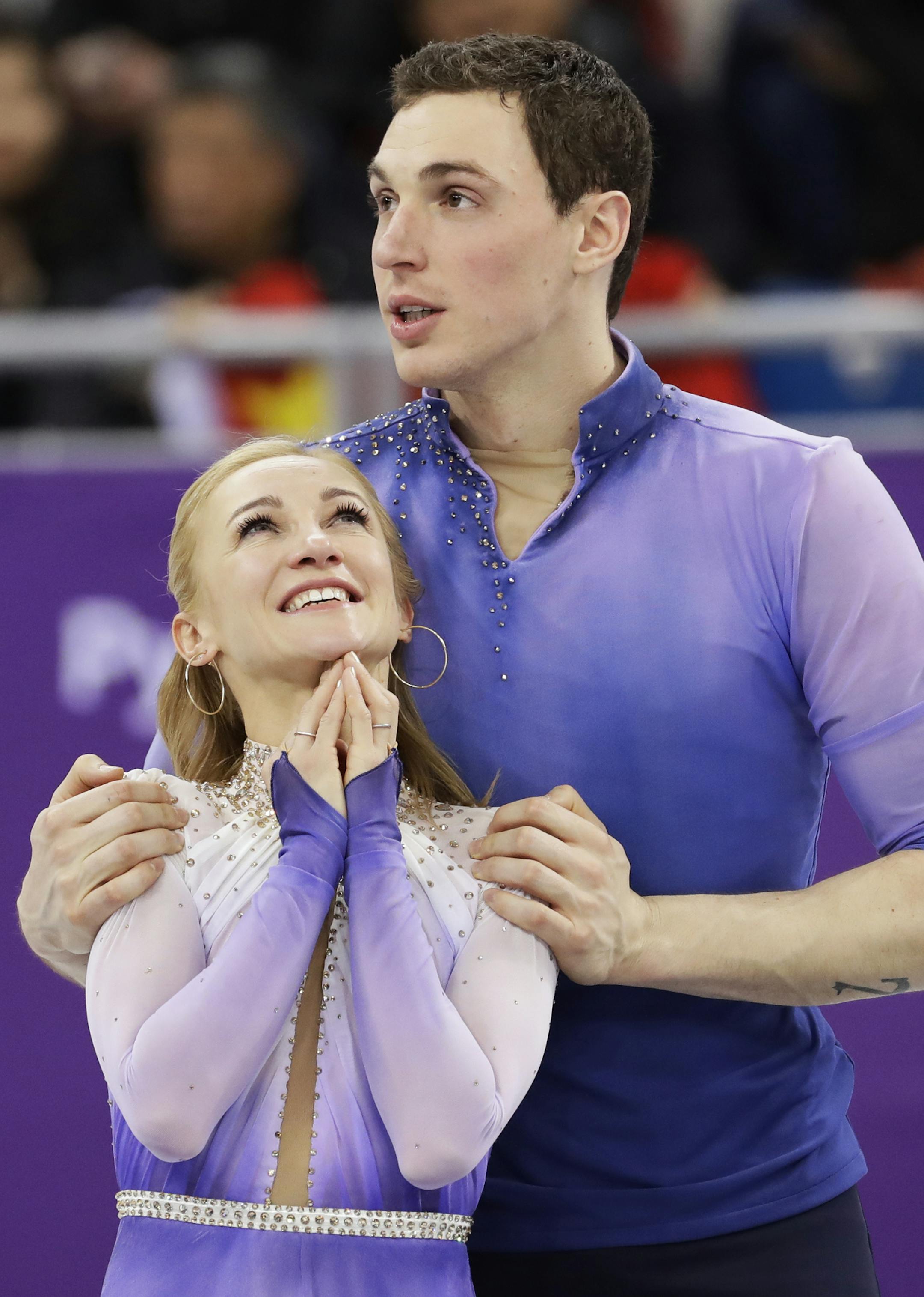 Aljona Savchenko and Bruno Massot of Germany celebrate on the podium after winning the pairs free skate figure skating final in the Gangneung Ice Arena at the 2018 Winter Olympics in Gangneung, South Korea, Thursday, Feb. 15, 2018. (AP Photo/Bernat Armangue)