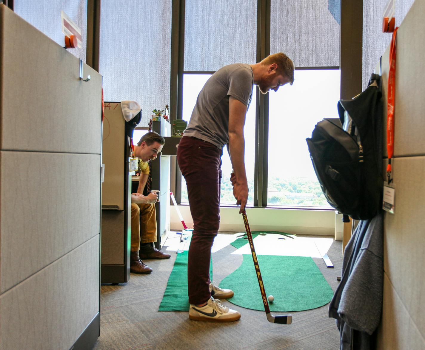 Chris Bremseth, the technical writer, was playing golf for a short break at the small golf field between cubes on the top floor. ] XAVIER WANG &#x2022; xavier.wang@startribune.com Employees in the company ALARM.COM use and live in the office space in a creative and fun way, which makes the office doesn't resemble the traditional call center. The photos were taken on Thursday June 1, 2017 in Bloomington.