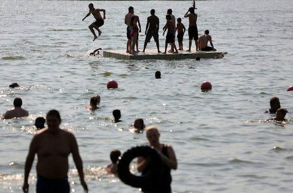 Beachgoers cool off at Lake Nokomis on July 2, 2012.