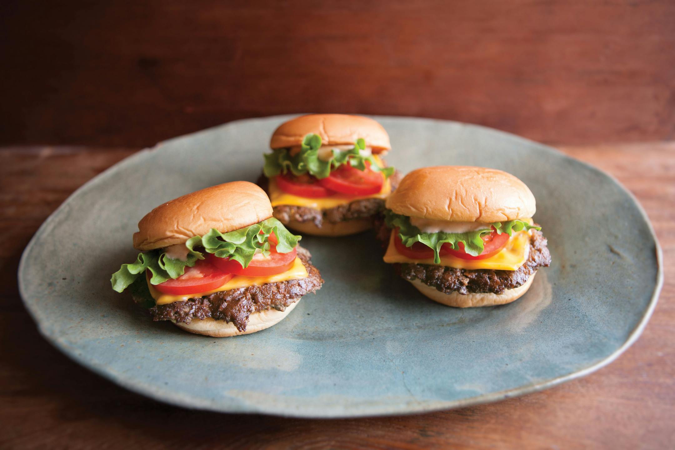 ShackBurgers from "Shake Shack, Recipes and Stories."
Reprinted from Shake Shack. Copyright © 2017 by Shake Shack Enterprises, LLC. Principal photographs copyright © 2017 by Christopher Hirsheimer. Published by Clarkson Potter/Publishers, an imprint of Penguin Random House, LLC.