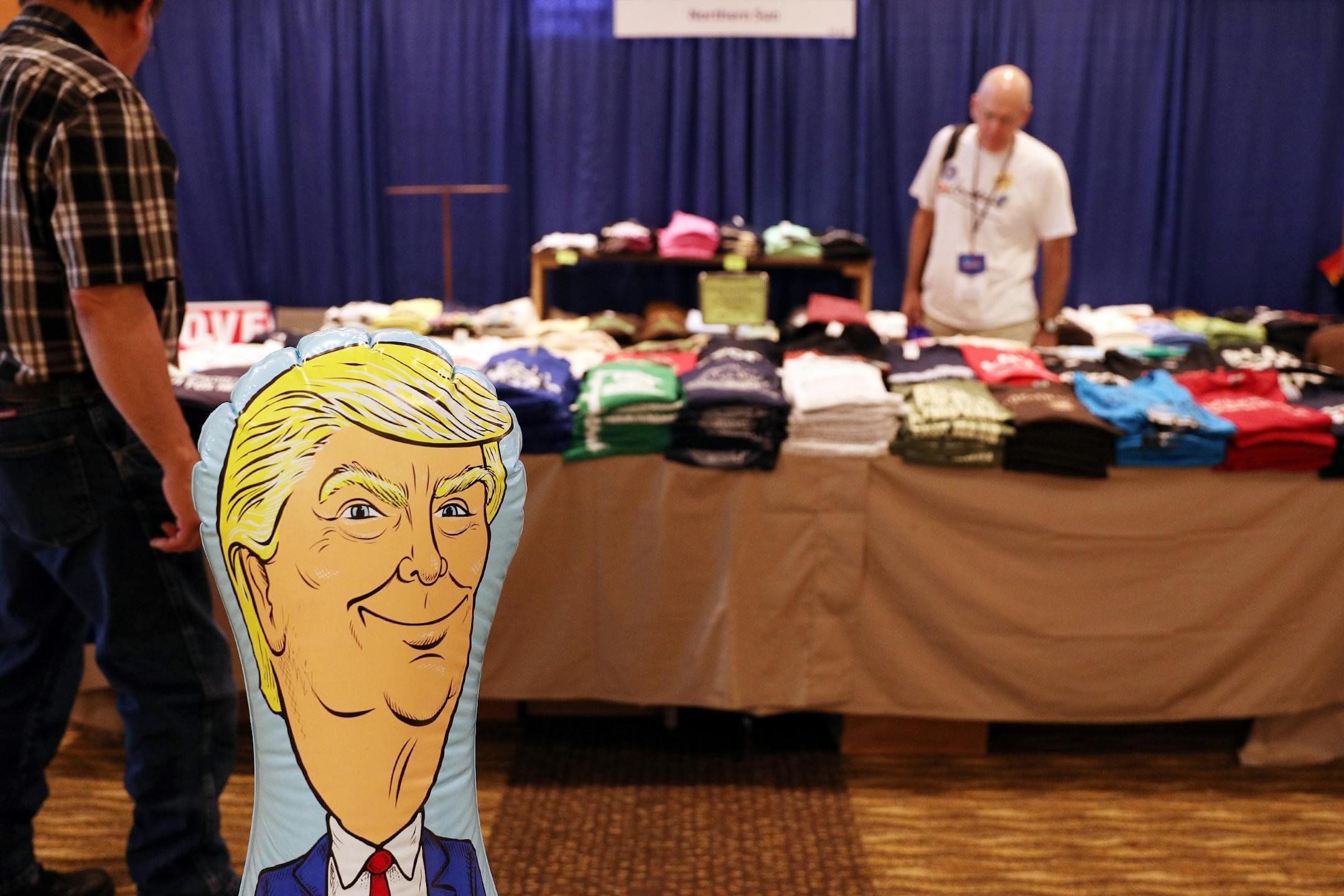 A blow up figure of President Donald Trump sat in front of a souvenir stand during the DFL State Convention Friday.