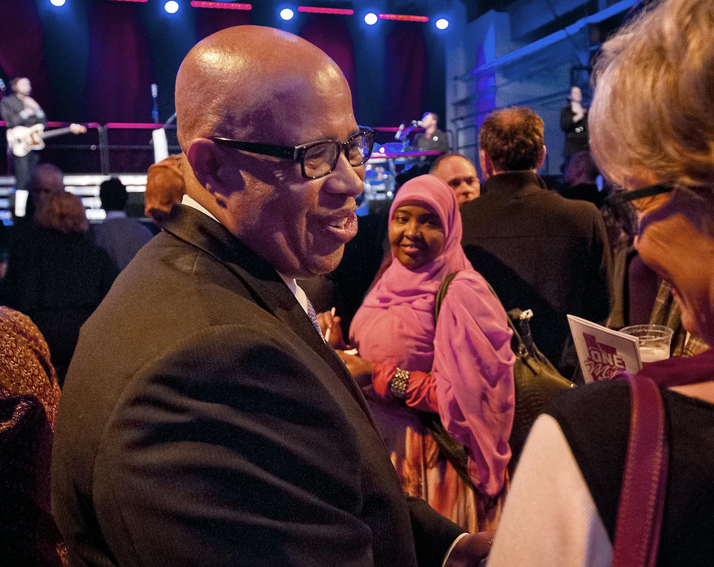 Mayor Hodges' husband Gary Cunningham speaks to a supporter during the mayor's inauguration party at the historic Thorp Building in Northeast Minneapolis, Saturday, January 11, 2014. [ BEN BREWER &#x201a;&#xc4;&#xf6;&#x221a;&#xd1;&#xac;&#xa2; Special to the Star Tribune _ Assignment # 118454 DATE 1/11/14 SLUG: FACE011414 EXTRA INFORMATION: Conclusion of "One Minneapolis" promotion over the past ten days with a focus on the arts and entertainment scene in the city. ORG XMIT: MIN1401121032211194