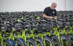 Sean Davis of Nice Ride worked at taking tags off bikes as the company rolled out its fleet throughout Minneapolis, Monday, April 22, 2019 in Minneapo