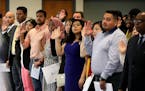 Ninety-four people took the Oath of Allegiance from Judge William J. Fisher and became new U.S. citizens during a Naturalization Ceremony Wednesday, M