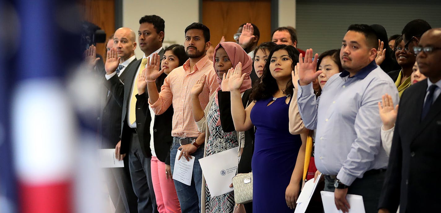 Ninety-four people took the Oath of Allegiance from Judge William J. Fisher and became new U.S. citizens during a Naturalization Ceremony Wednesday, May 24, 2017, at the Roseville Skating Center in Roseville, MN. Here, new citizens recite the Pledge of Allegiance before the end of the event.] DAVID JOLES &#xef; david.joles@startribune.com Checking reports that Roseville could become the first suburb in Minnesota to become a sanctuary city -- all the more striking in that it's an aging community,