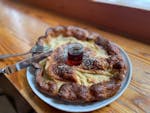 Puffy Dutch baby pancakes are served with local maple syrup at Darling in Minneapolis.