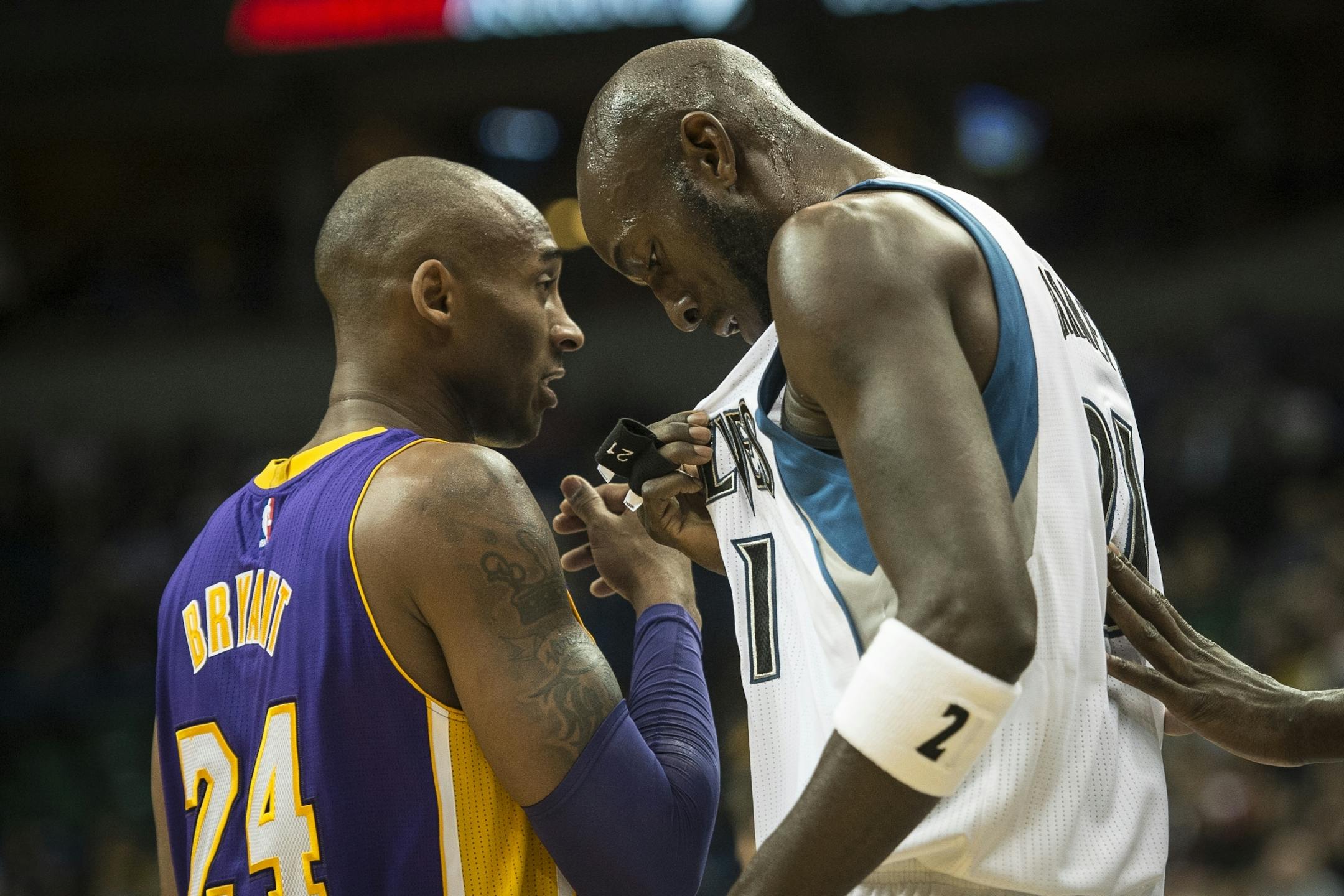 Los Angeles Lakers forward Kobe Bryant (24) and Minnesota Timberwolves forward Kevin Garnett (21) stood side by side during a break in first quarter action Wednesday night.