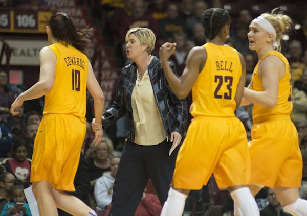Gopher's head coach Marlene Stollings speaks with players during half time, Feb. 23, 2017, during a match against Purdue at Williams Arena in Minneapo