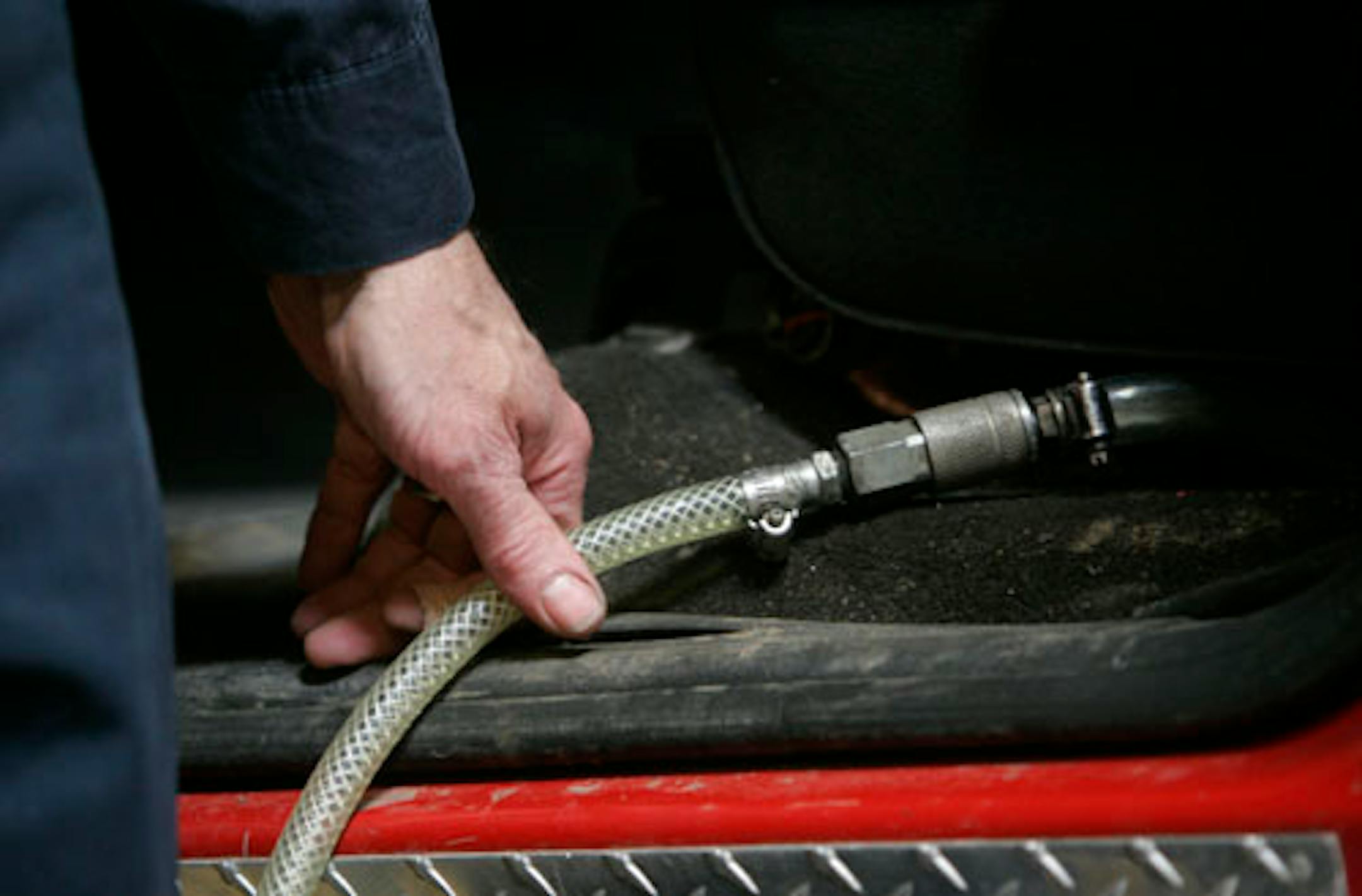 One of the tubes runs underneath the driver's seat. Chad Storey, left, was arrested Monday and charged Tuesday with a felony count of possession of burglary tools.