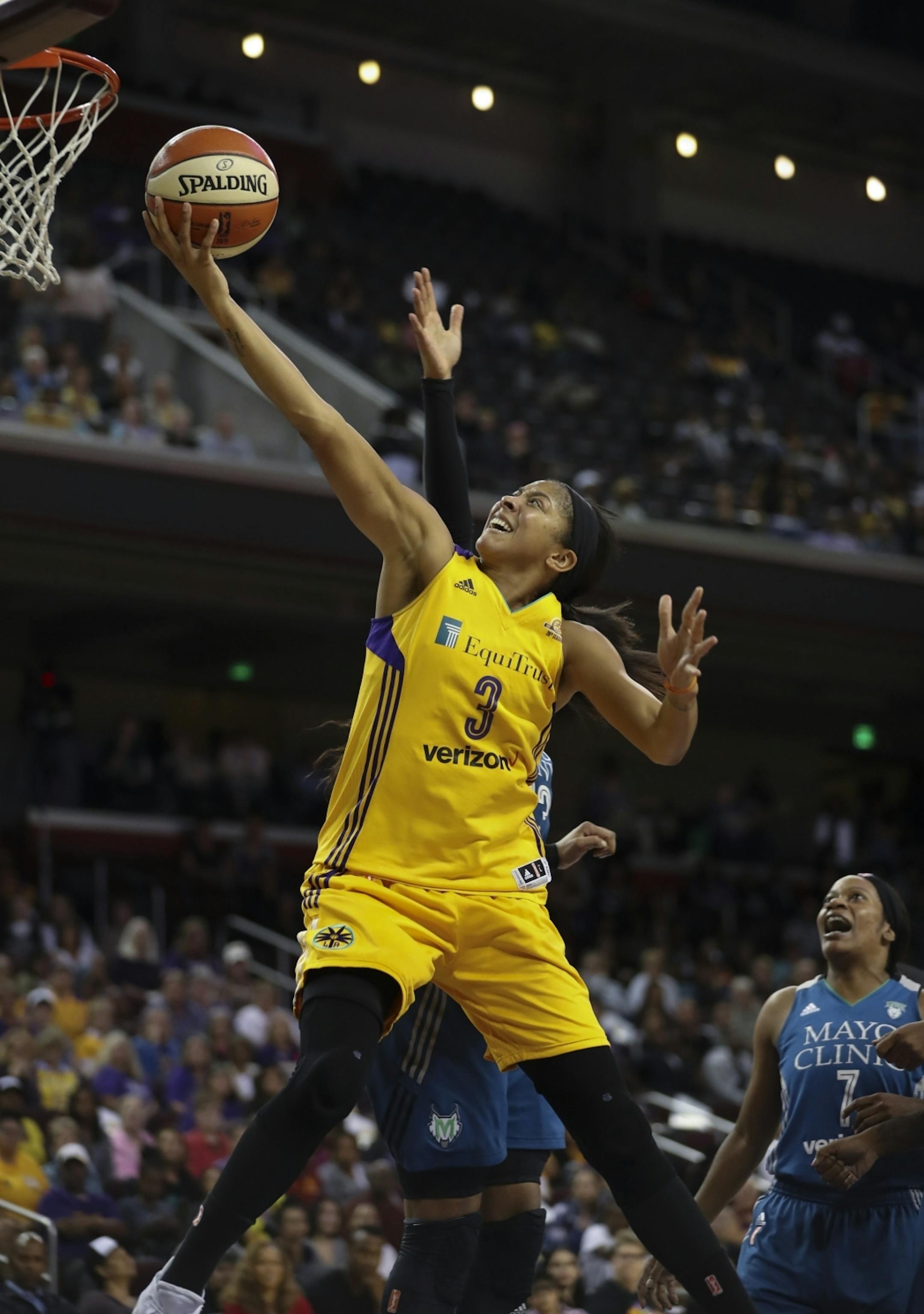 Los Angeles Sparks forward Candace Parker (3) put up two of her game-high 24 points in the second half as she was defended by Minnesota Lynx forward Maya Moore (23).